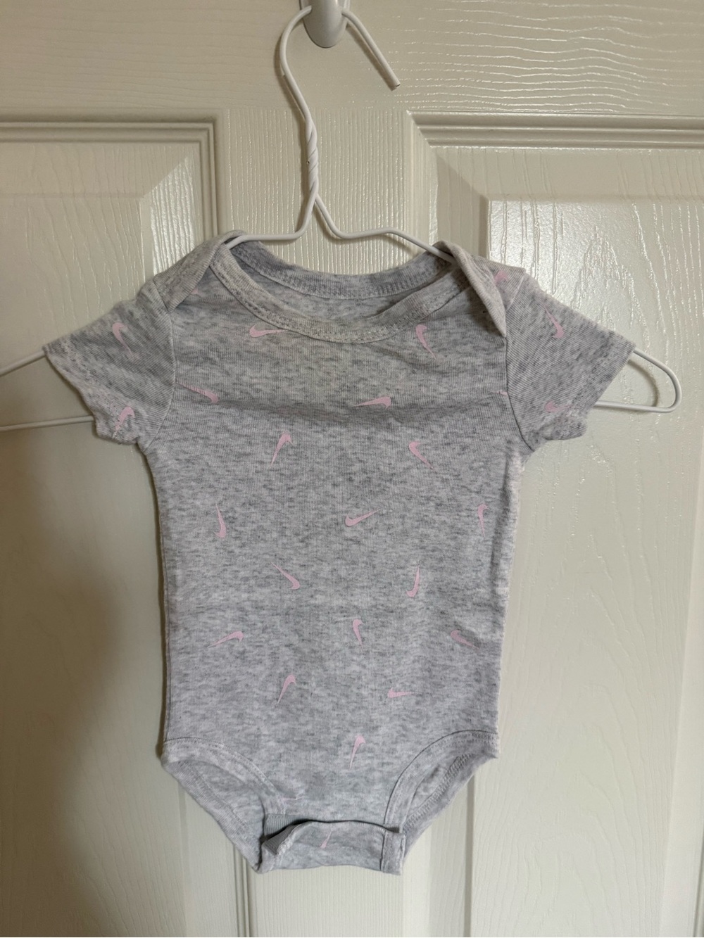 Nike Gray One-Piece Bodysuit with Pink Swoosh Print